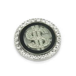 Luxury silver spinning dollar sign charm accessory with white crystals on a white background