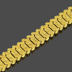 Men's 18k gold plated watch-style bracelet with textured star link patterns