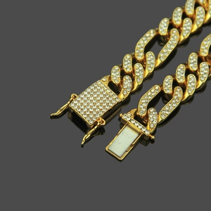 12mm gold Cuban link bracelet with iced out rhinestones and butterfly clasp details