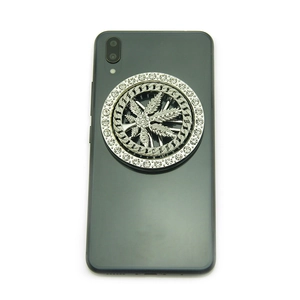 Rotating maple leaf phone ring holder with silver metal and white rhinestones