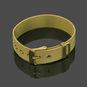 Adjustable gold mesh bracelet with watch-style buckle on a dark reflective background