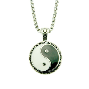 Detail of vintage Tai Chi Yin Yang pendant with silver steel box chain and crystal inlay