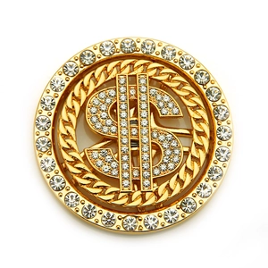 Close-up of a rotating gold dollar sign accessory with rhinestones for DIY phone cases