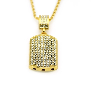 Close-up of iced-out gold military tag pendant with rope chain and sparkling crystals