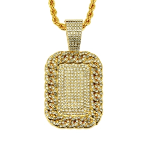 Detailed view of hip hop dog tag pendant with CZ diamonds and gold twisted rope chain