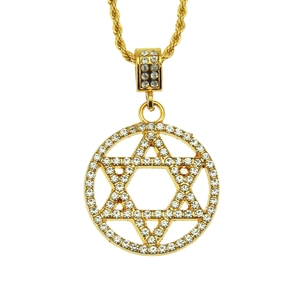 Macro detail of gold Star of David pendant with white crystals and twisted chain