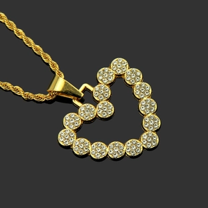 Hip hop heart pendant necklace with gold plating and sparkling rhinestones on rope chain