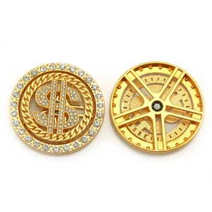 Golden rotating dollar sign charm with rhinestones and precision ball bearing
