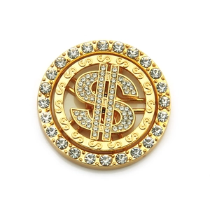 Macro shot of spinning dollar sign phone accessory with luxury gold plating and crystals