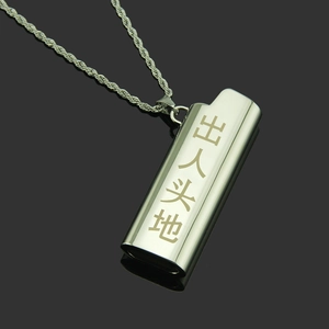 Detail of lighter-shaped pendant with Chinese engraving on a metallic twist chain