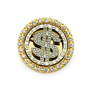 Close-up of a rotating rhinestone dollar sign phone accessory with a gold and silver finish