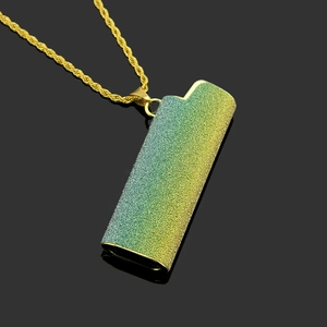 Close-up of Harajuku lighter case pendant necklace with green and yellow gradient finish