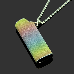 Close-up of rainbow glitter lighter case pendant with silver rope chain for men