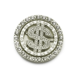 Macro detail of rotating silver US dollar phone accessory with sparkling rhinestones