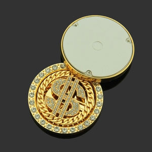 Rotating gold dollar sign phone accessory with sparkling rhinestones and adhesive back