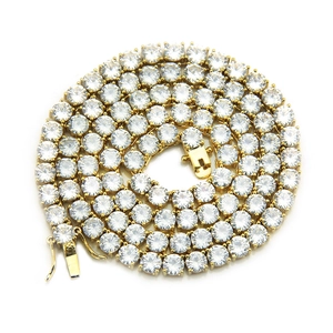Detail of 4mm gold tennis chain with round-cut cubic zirconia and secure clasp