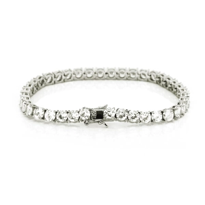 Macro detail of silver tennis bracelet featuring round-cut cubic zirconia and safety clasp