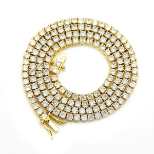 Detail of 4mm gold tennis chain with micro-pave zircons and secure double clasp closure