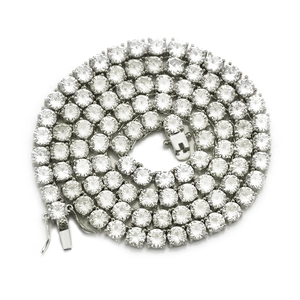 Macro detail of silver tennis chain with 4mm cubic zirconia stones and secure clasp closure
