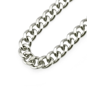 Detail of chunky silver curb chain with polished metallic finish for punk pants styling
