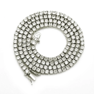 Detail of 4mm silver tennis chain showing cubic zirconia stones in 4-claw settings