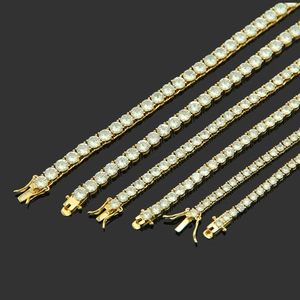 Set of six gold plated tennis bracelets with sparkling cubic zirconia in varying widths