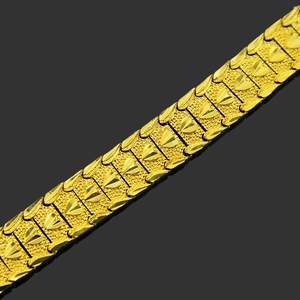 Hip hop gold bracelet with wide links featuring matte texture and heart-shaped relief details