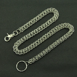 Silver woven metal trouser chain with lobster clasp and keyring on black background