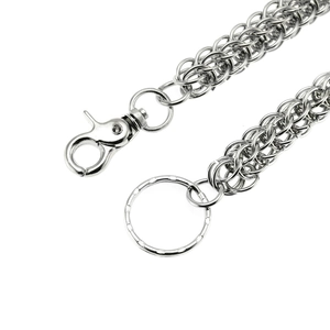 Silver metal pants chain with heavy link weave, lobster clasp and key ring on white background