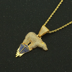 Iced out polar bear pendant necklace with blue crystals and gold rope chain