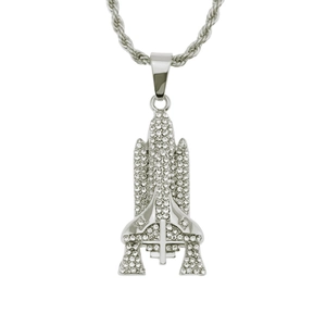 Detailed view of silver space shuttle pendant with white rhinestones and rope chain