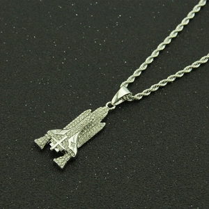 Iced out rocket pendant necklace with sparkling crystals and silver twisted rope chain