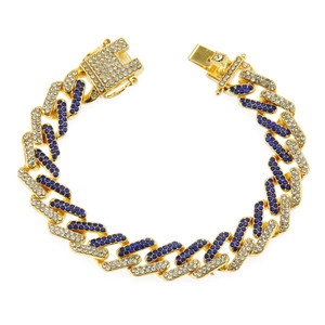 Golden Cuban link bracelet with sparkling blue and white rhinestones on white background