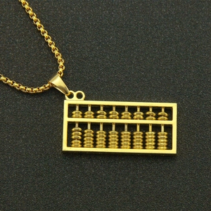 3D gold abacus pendant necklace with box chain on a dark textured background