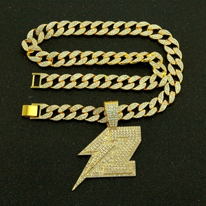 Iced out gold Cuban link chain with large lightning bolt pendant for men hip hop style