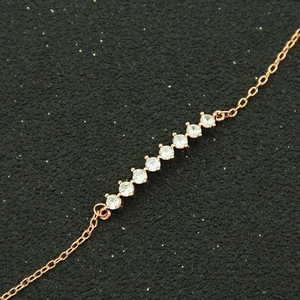 Bracelet élégant en cuivre or rose orné de neuf oxydes de zirconium ronds étincelants