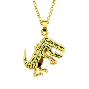 Macro detail of golden dinosaur pendant featuring green and red textured wavy patterns