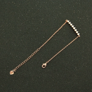 Bracelet élégant en cuivre or rose avec sept pierres de zircone et pendentif en forme de cœur