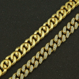 Detailed close-up of gold iced out cuban link bracelet with sparkling clear crystals