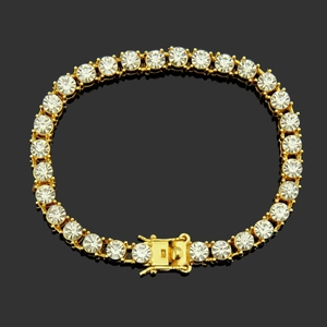 Detailed view of golden tennis bracelet with round cubic zirconia in claw setting