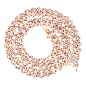 Macro detail of rose gold Cuban link chain with square diamonds and iced out clasp