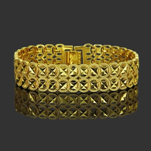 Men's double-row golden geometric link bracelet with textured pyramid accents