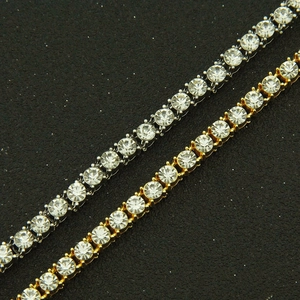 Macro shot of gold and silver single row tennis bracelets with micro-pave zircons