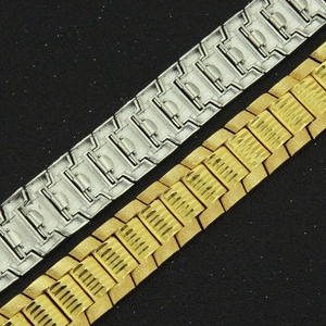 Macro shot of gold and silver punk bracelets showing diagonal grooves and sandblasted texture