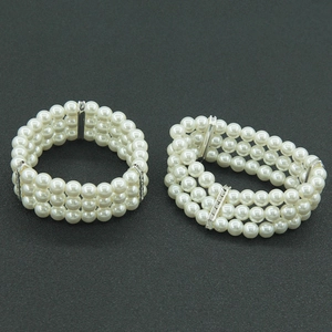 Elegant multi-layer pearl bracelet with diamond accents and silver metal spacers
