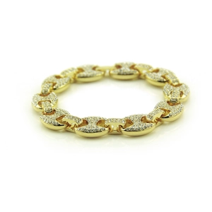 Close-up of golden Mariner chain bracelet with sparkling white rhinestones in hip hop style