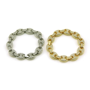Hip hop style geometric iced out bracelet in gold and silver plating with clear stones