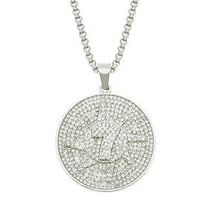 Macro shot of silver hip hop pendant with iced-out crystals and number 7 design