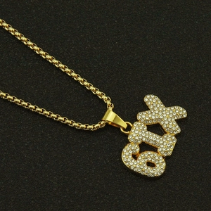Hip hop gold plated necklace featuring iced out SIX letter pendant with white crystals