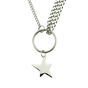 Detailed view of silver asymmetric steel chain with round ring and star pendant